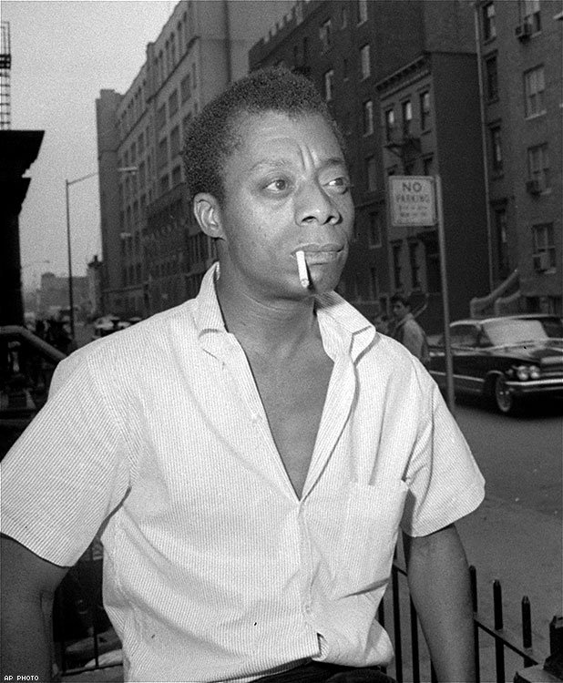 Author James Baldwin, shown on a Harlem street in New York City, June 3, 1963