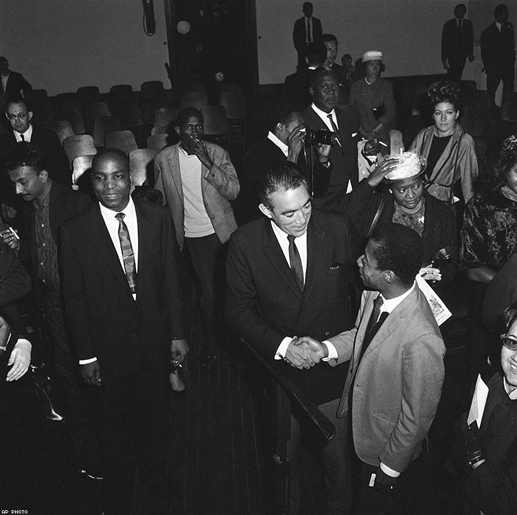 Baldwin is congratulated by actor Anthony Quinn