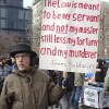January 19, 2015: Several hundred activists gathered at Union Square Park prior to starting the Four Mile March on Martin Luther King's birthday. An activist holds a sign quoting James Baldwin.